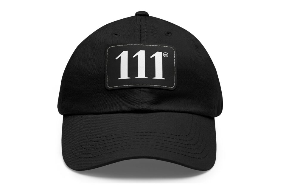 Black baseball cap with a rectangular patch displaying the number 111 in white.