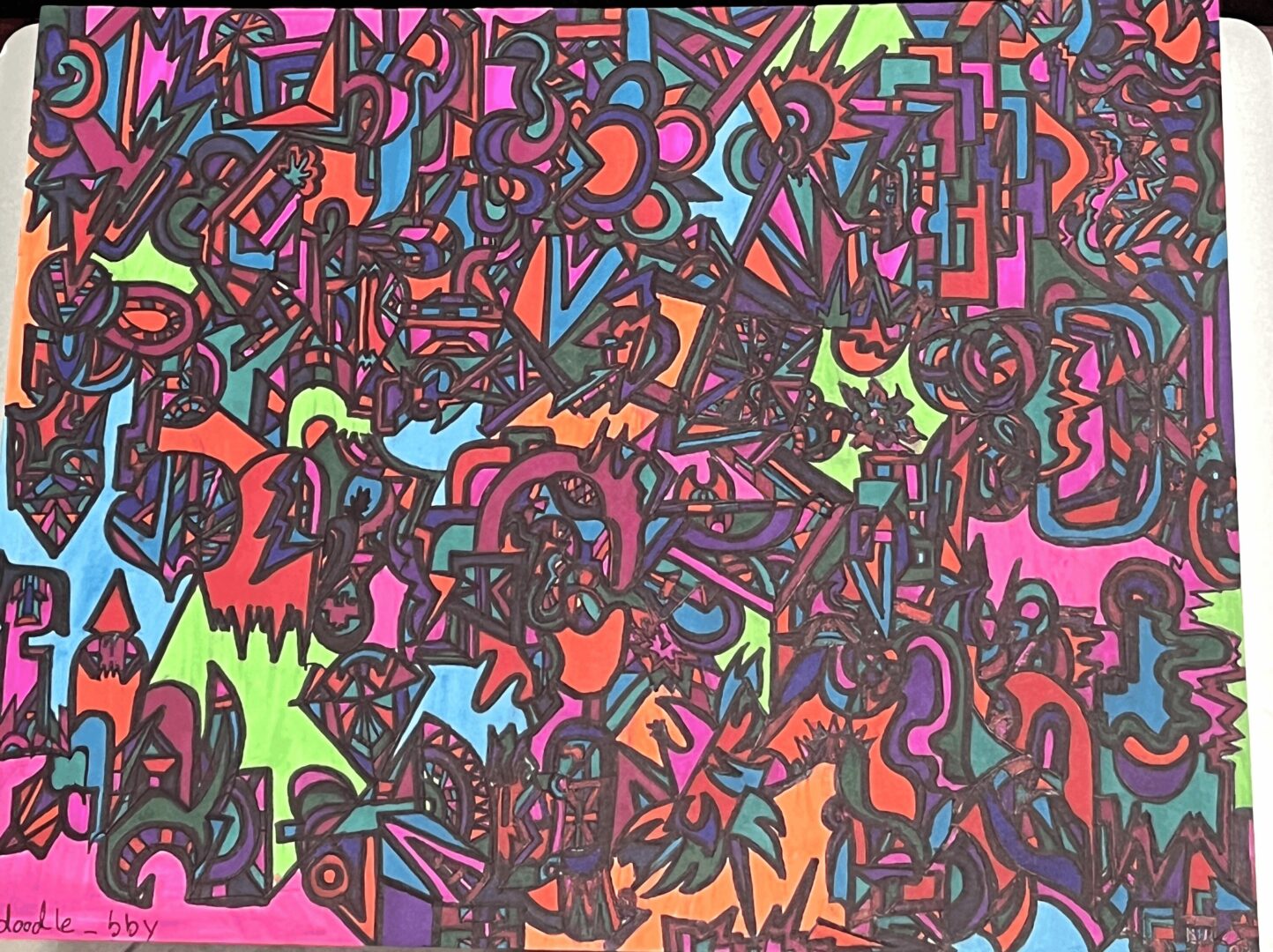 Colorful abstract drawing with various shapes, lines, and patterns in vibrant colors on a pink background.